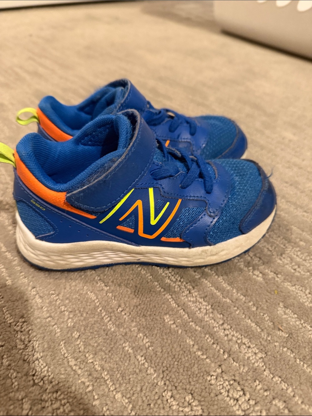 New Balance Kids Blue Sneakers with Orange and Neon Yellow Accents